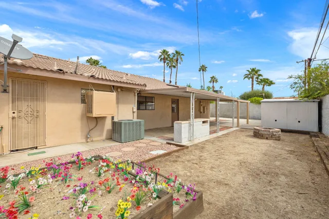 a view of a living room and chandelier