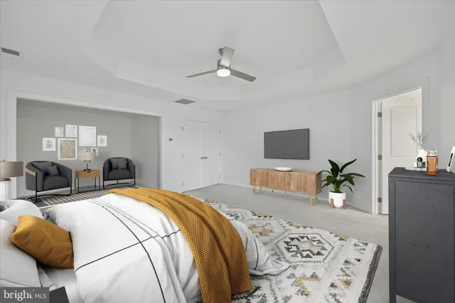 a bedroom with a bed and furniture