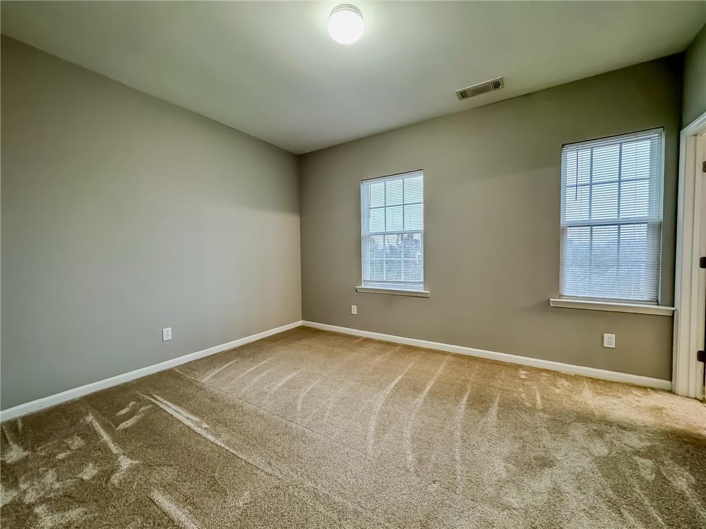 1218 Park Pass Way Suwanee, GA 30024 - Photo 18 of 23 an empty room with windows