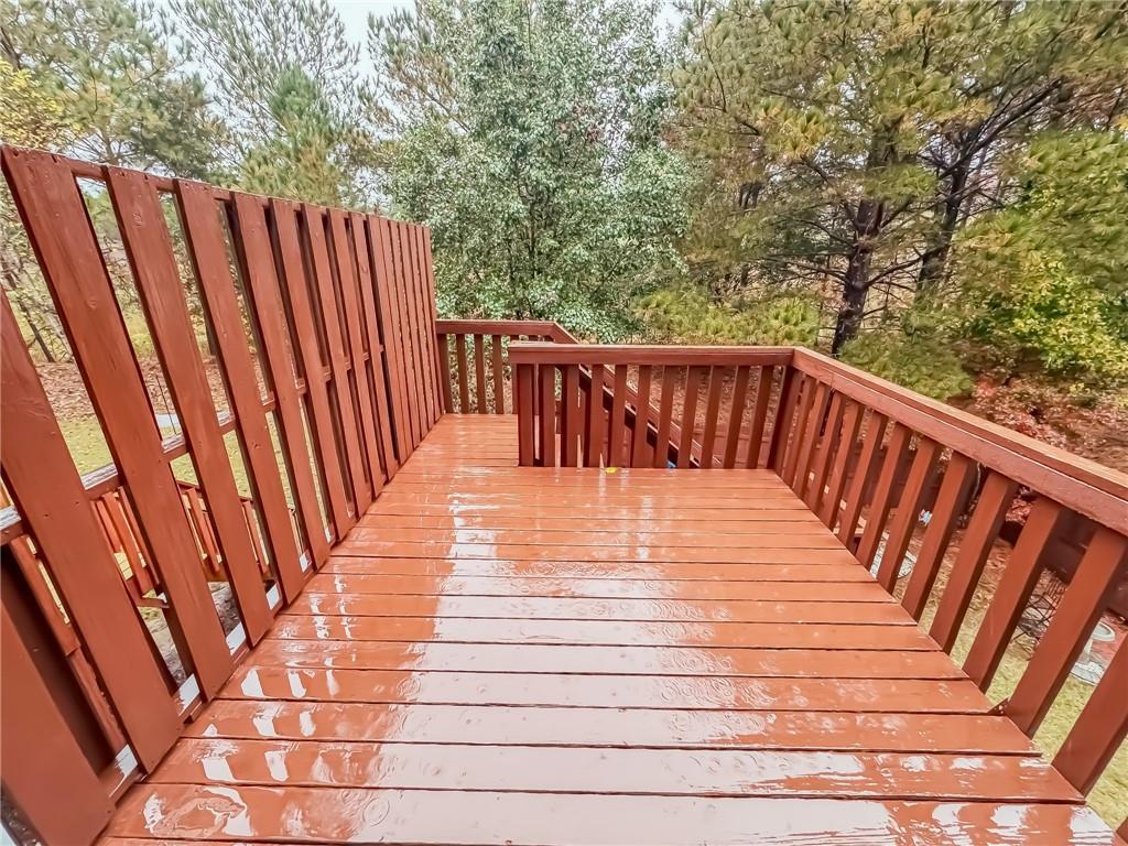 1218 Park Pass Way Suwanee, GA 30024 - Photo 21 of 23 a balcony with wooden floor
