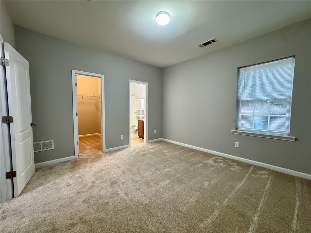 1218 Park Pass Way Suwanee, GA 30024 - Photo 3 of 23 an empty room with windows
