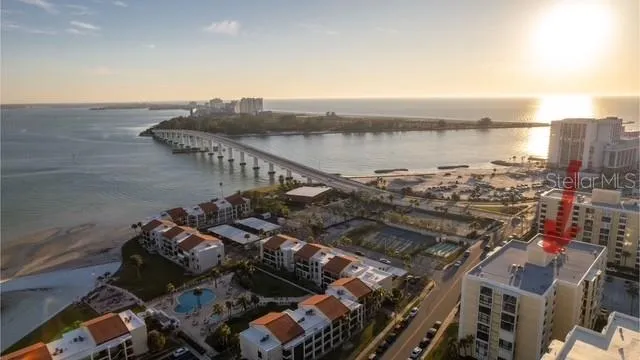 a view of a room with wooden floor and windows