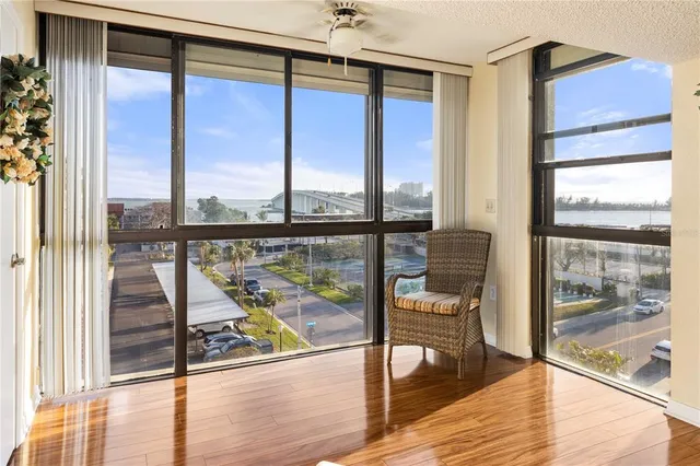 a bedroom with bed and wooden floor