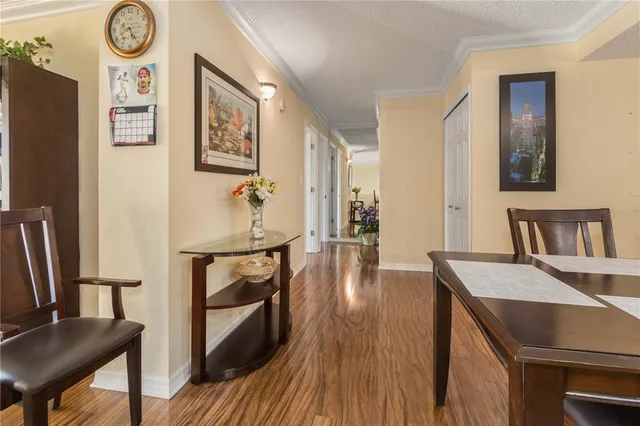 a bathroom with a granite countertop sink a mirror and a toilet