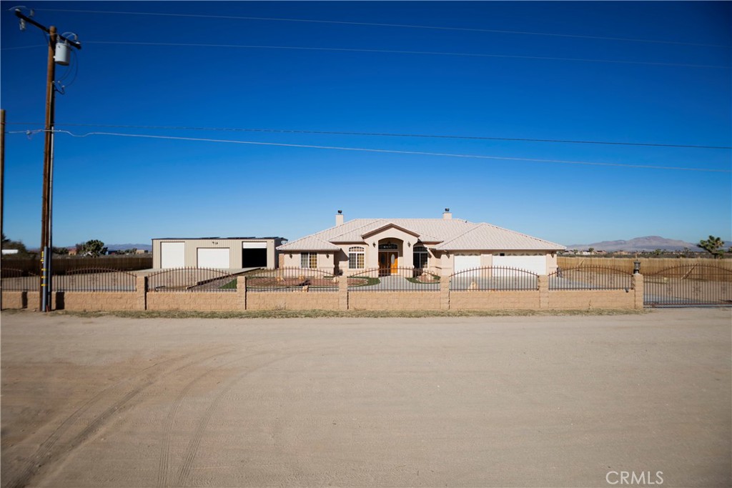 11830 Joshua Dell Road Victorville, CA 92392 - Photo 13 of 48 a view of residential houses with road