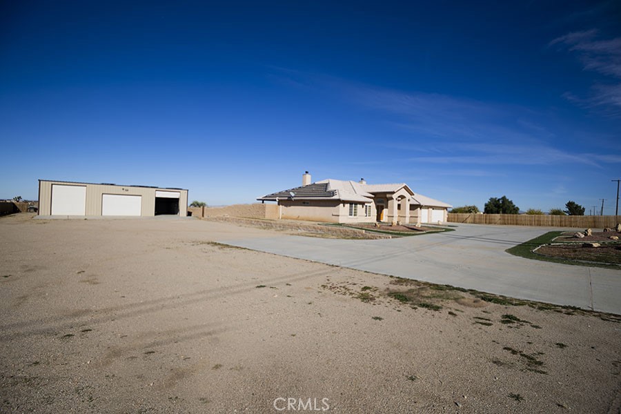 11830 Joshua Dell Road Victorville, CA 92392 - Photo 15 of 48 a view of a street with some trees