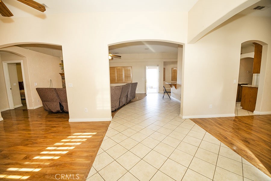11830 Joshua Dell Road Victorville, CA 92392 - Photo 16 of 48 a view of a living room and a rug