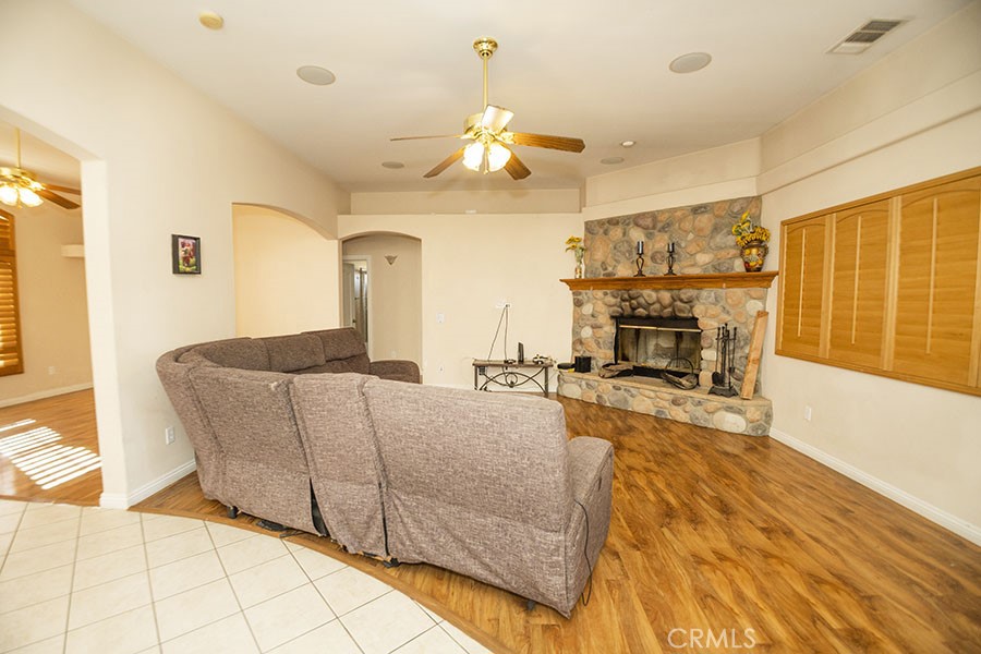 11830 Joshua Dell Road Victorville, CA 92392 - Photo 21 of 48 a living room with furniture and a fireplace