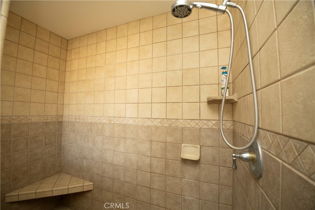 11830 Joshua Dell Road Victorville, CA 92392 - Photo 29 of 48 a bathroom with a shower