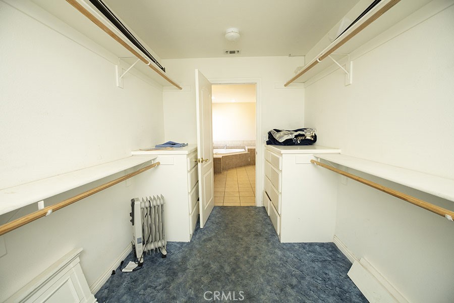 11830 Joshua Dell Road Victorville, CA 92392 - Photo 32 of 48 a view of a storage & utility room with a sink