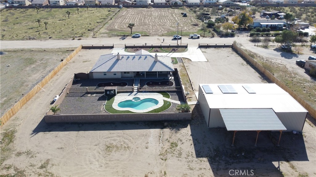 11830 Joshua Dell Road Victorville, CA 92392 - Photo 4 of 48 an aerial view of a house with swimming pool