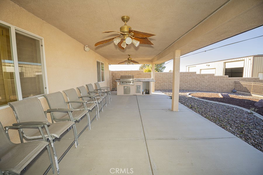 11830 Joshua Dell Road Victorville, CA 92392 - Photo 42 of 48 a living room with furniture and a large window