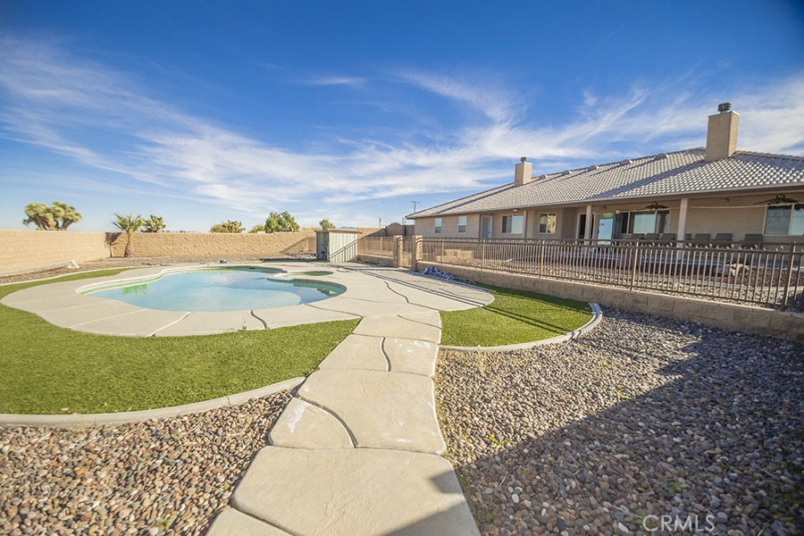 11830 Joshua Dell Road Victorville, CA 92392 - Photo 44 of 48 a view of a house with swimming pool