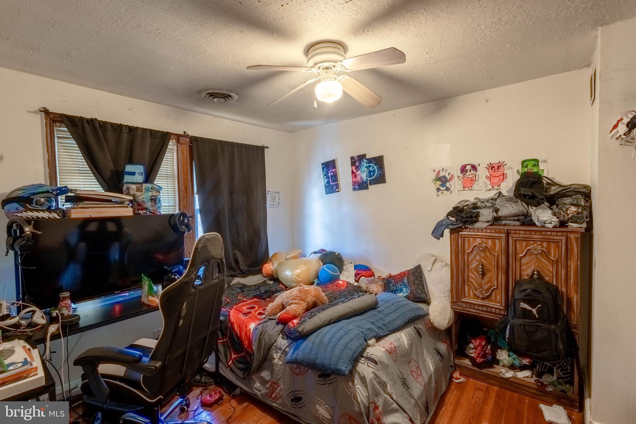 35 Kinship Road Baltimore, MD 21222 - Photo 12 of 15 a bedroom with bed and a chandelier