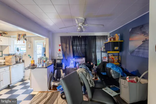 a room with furniture a chandelier and a window