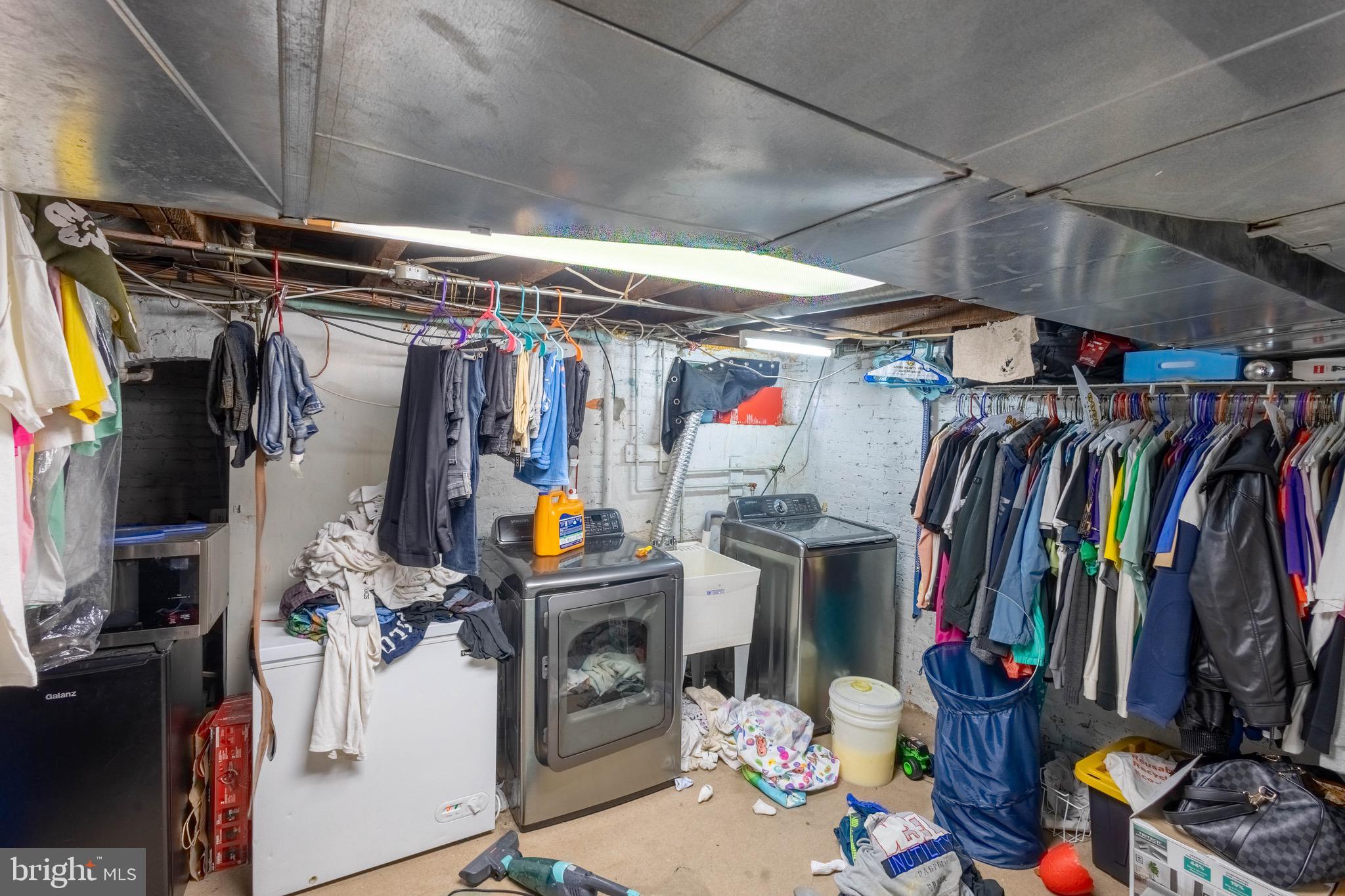 35 Kinship Road Baltimore, MD 21222 - Photo 8 of 15 a view of walk in closet with clothes and shoes