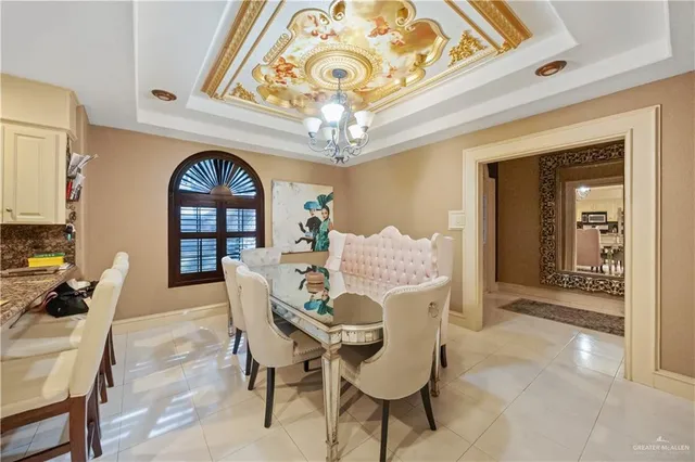 a dining room with furniture and window