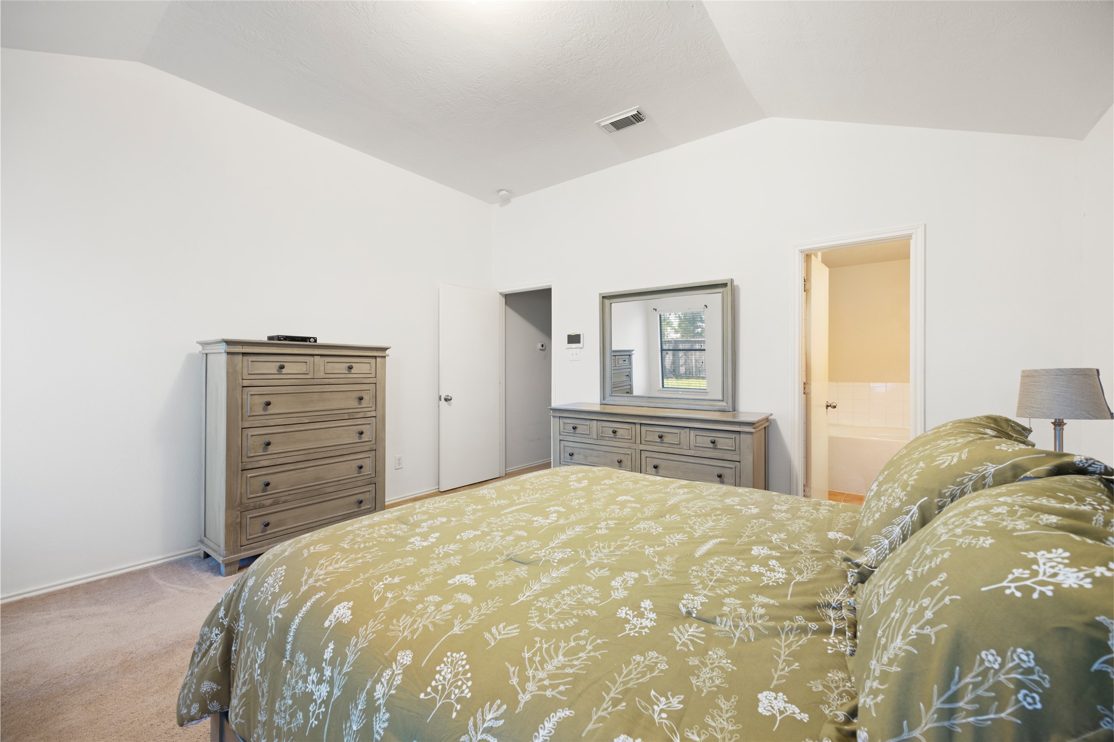 15926 Colonial Bridge Lane Houston, TX 77073 - Photo 15 of 27 a bedroom with a bed and dresser