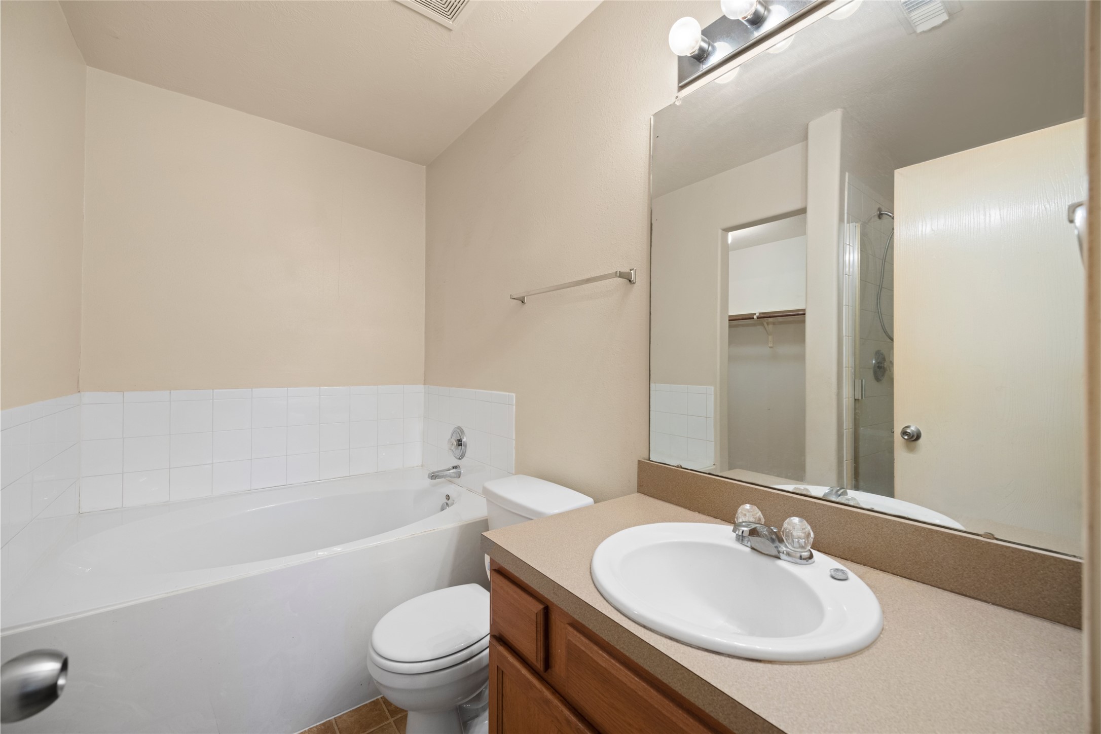 15926 Colonial Bridge Lane Houston, TX 77073 - Photo 17 of 27 a bathroom with a sink toilet tub and shower