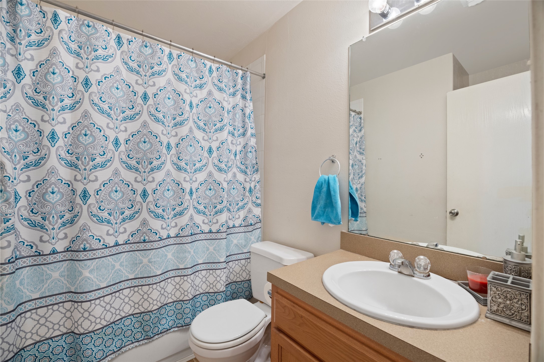 15926 Colonial Bridge Lane Houston, TX 77073 - Photo 20 of 27 a bathroom with a granite countertop sink and a toilet