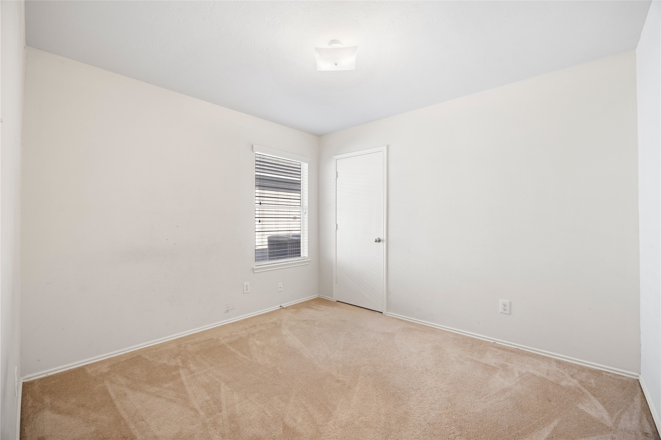 15926 Colonial Bridge Lane Houston, TX 77073 - Photo 21 of 27 an empty room with windows