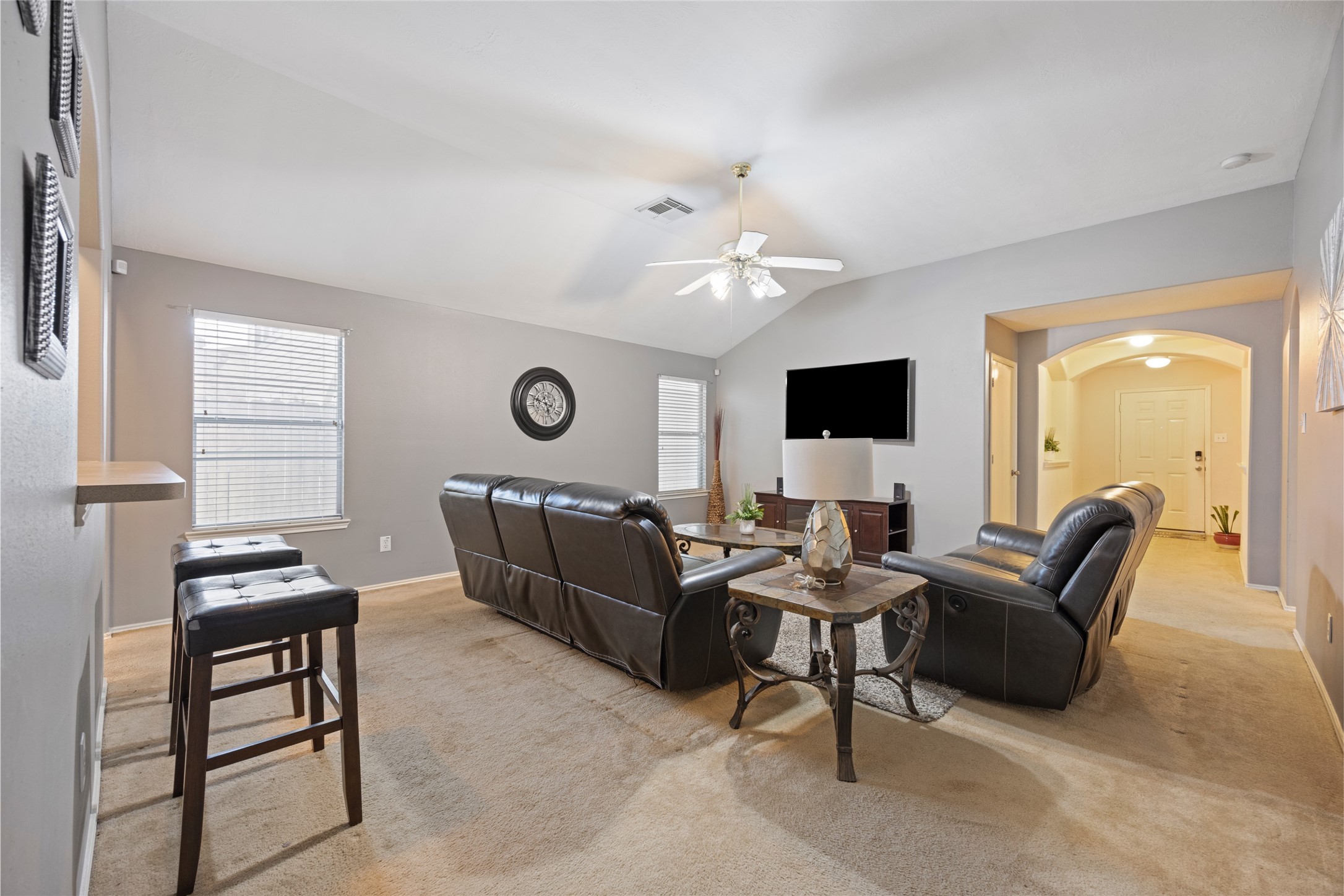 15926 Colonial Bridge Lane Houston, TX 77073 - Photo 7 of 27 a living room with furniture and a flat screen tv