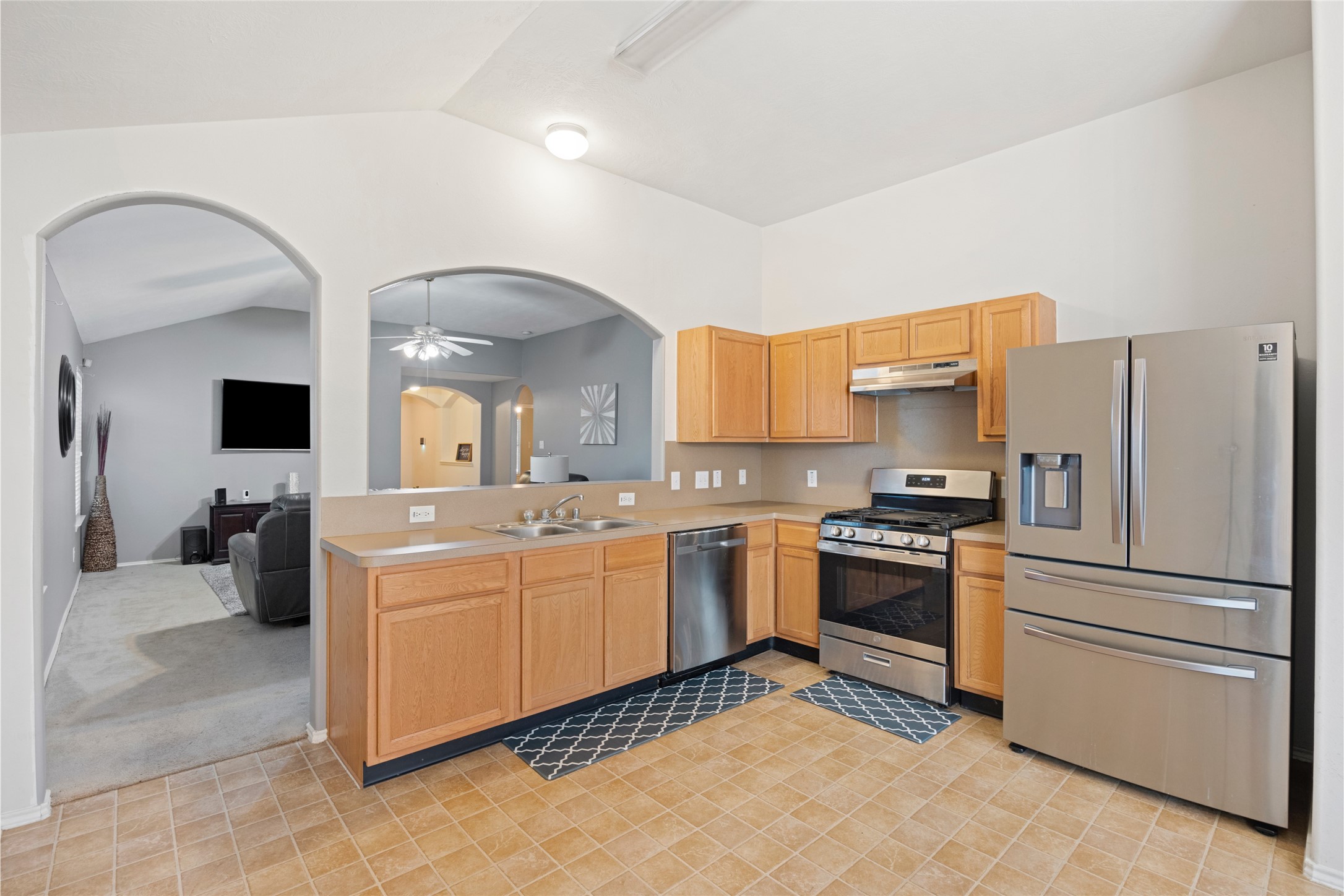15926 Colonial Bridge Lane Houston, TX 77073 - Photo 9 of 27 a kitchen with a sink cabinets and stainless steel appliances