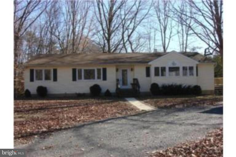 3511 Patuxent Road Huntingtown, MD 20639 - Photo 1 of 23 a front view of a house with a yard