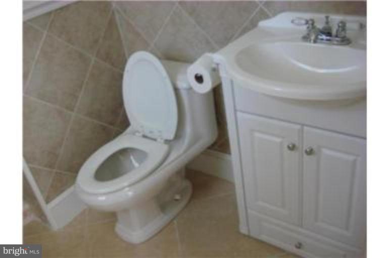 3511 Patuxent Road Huntingtown, MD 20639 - Photo 11 of 23 a close view of a toilet in a bathroom