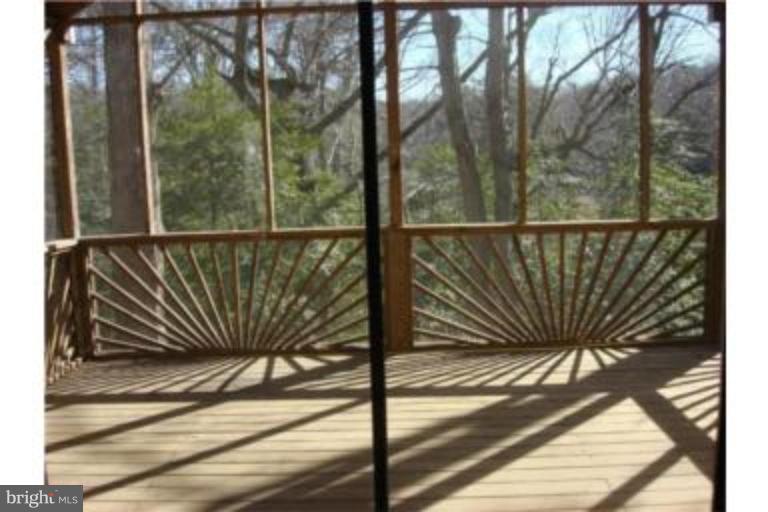 3511 Patuxent Road Huntingtown, MD 20639 - Photo 16 of 23 a view of balcony with floor to ceiling window and tree