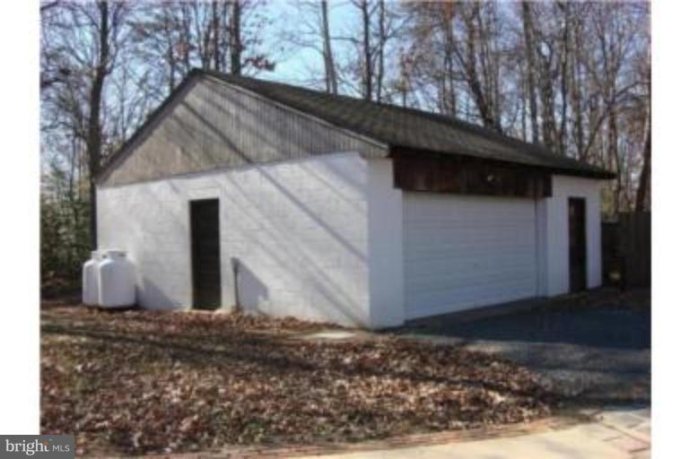 3511 Patuxent Road Huntingtown, MD 20639 - Photo 18 of 23 a view of a house with a yard