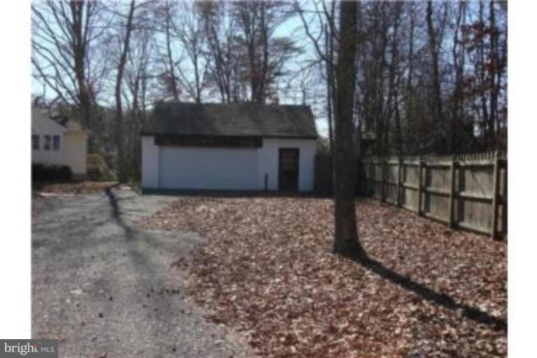 3511 Patuxent Road Huntingtown, MD 20639 - Photo 19 of 23 a front view of a house with a yard