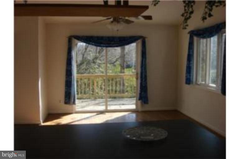 3511 Patuxent Road Huntingtown, MD 20639 - Photo 4 of 23 a view of a livingroom with wooden floor and a window