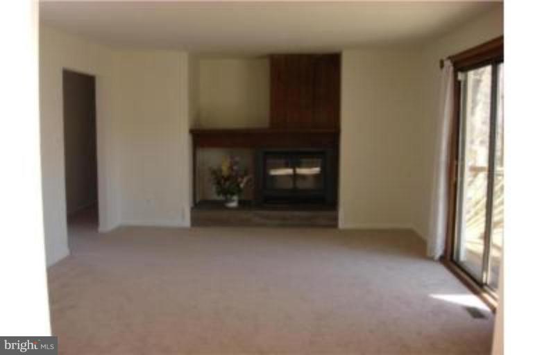 3511 Patuxent Road Huntingtown, MD 20639 - Photo 5 of 23 a view of empty room with a fireplace