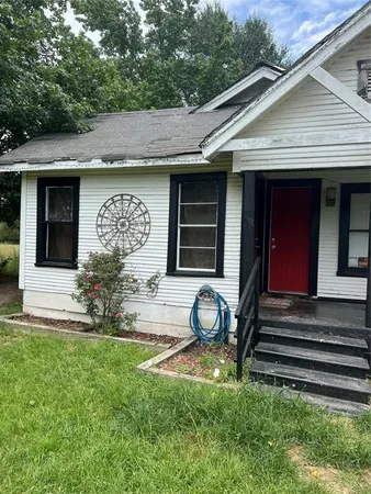 a house with garden in front of it