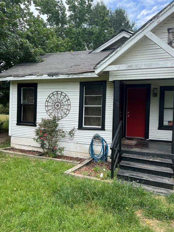 3061 Co Road, Unit 4210 Athens, TX 75752 - Photo 1 of 2 a house with garden in front of it