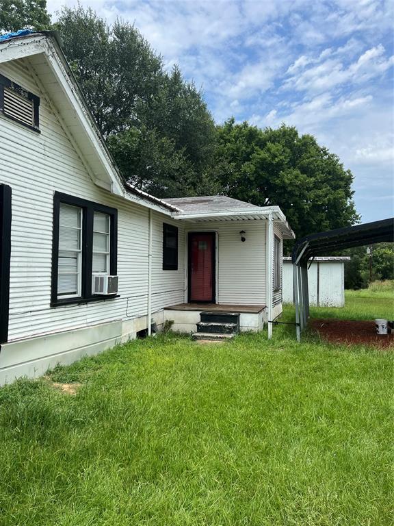 3061 Co Road, Unit 4210 Athens, TX 75752 - Photo 2 of 2 a front view of a house with a garden