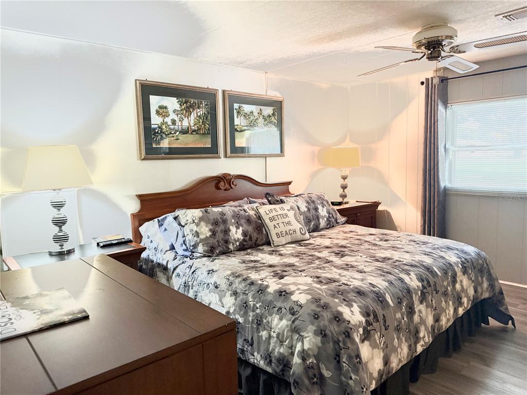 8010 Highpoint Boulevard Brooksville, FL 34613 - Photo 13 of 32 a bedroom with a bed and window