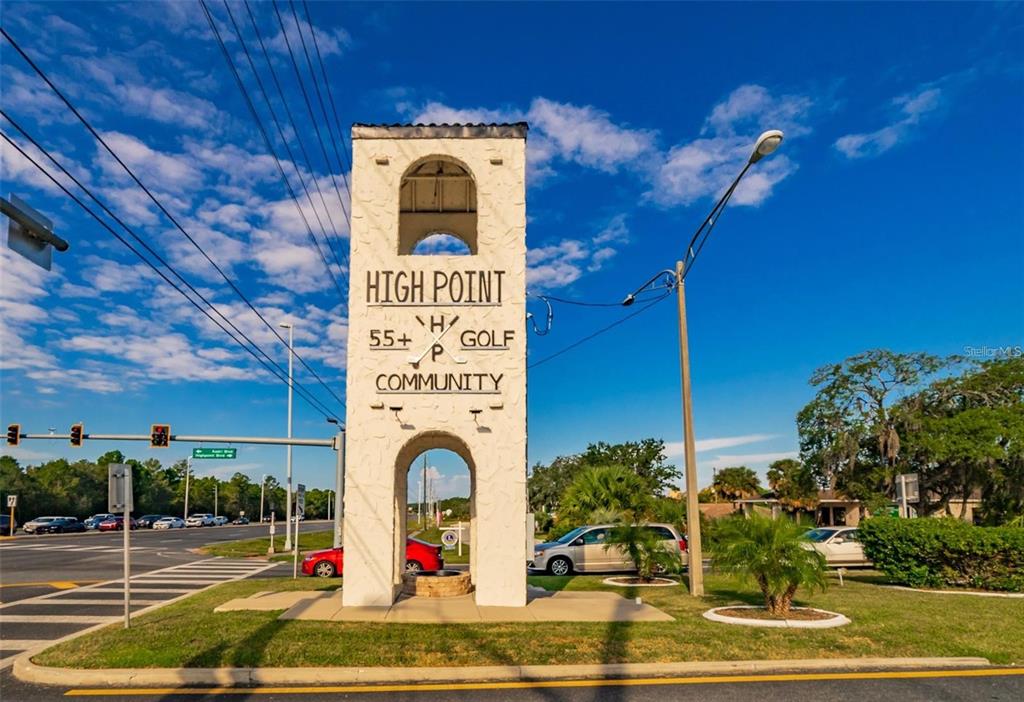 8010 Highpoint Boulevard Brooksville, FL 34613 - Photo 26 of 32 a front view of a building with garden