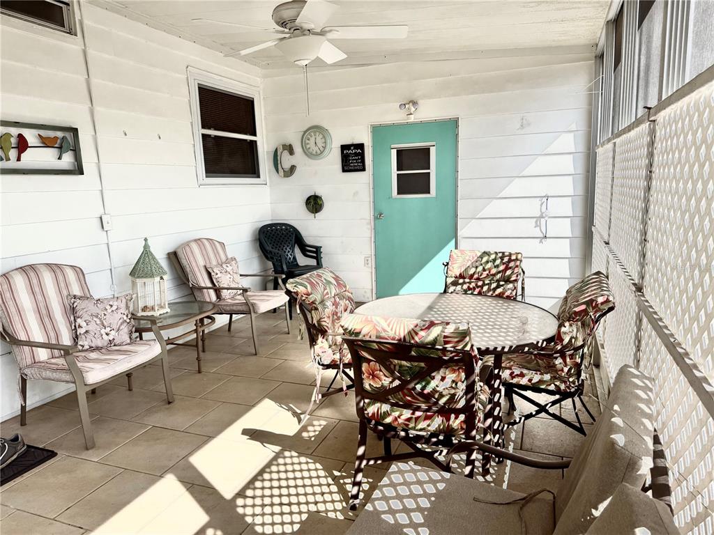 8010 Highpoint Boulevard Brooksville, FL 34613 - Photo 3 of 32 a view of a livingroom with furniture and a flat screen tv