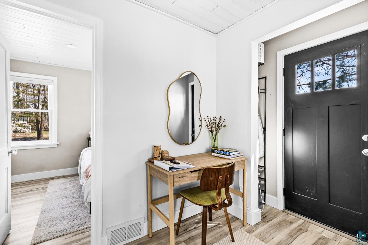 3645 Haines Road Hermantown, MN 55811 - Photo 17 of 35 Entryway with a black paneled door featuring three-lite windows