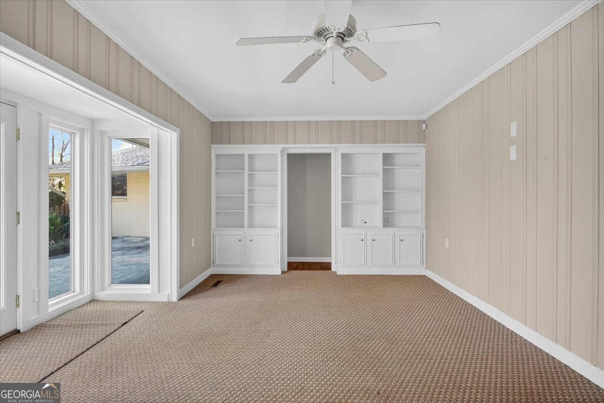 4555 Old Club Road Macon, GA 31210 - Photo 12 of 38 an empty room with chandelier fan and windows