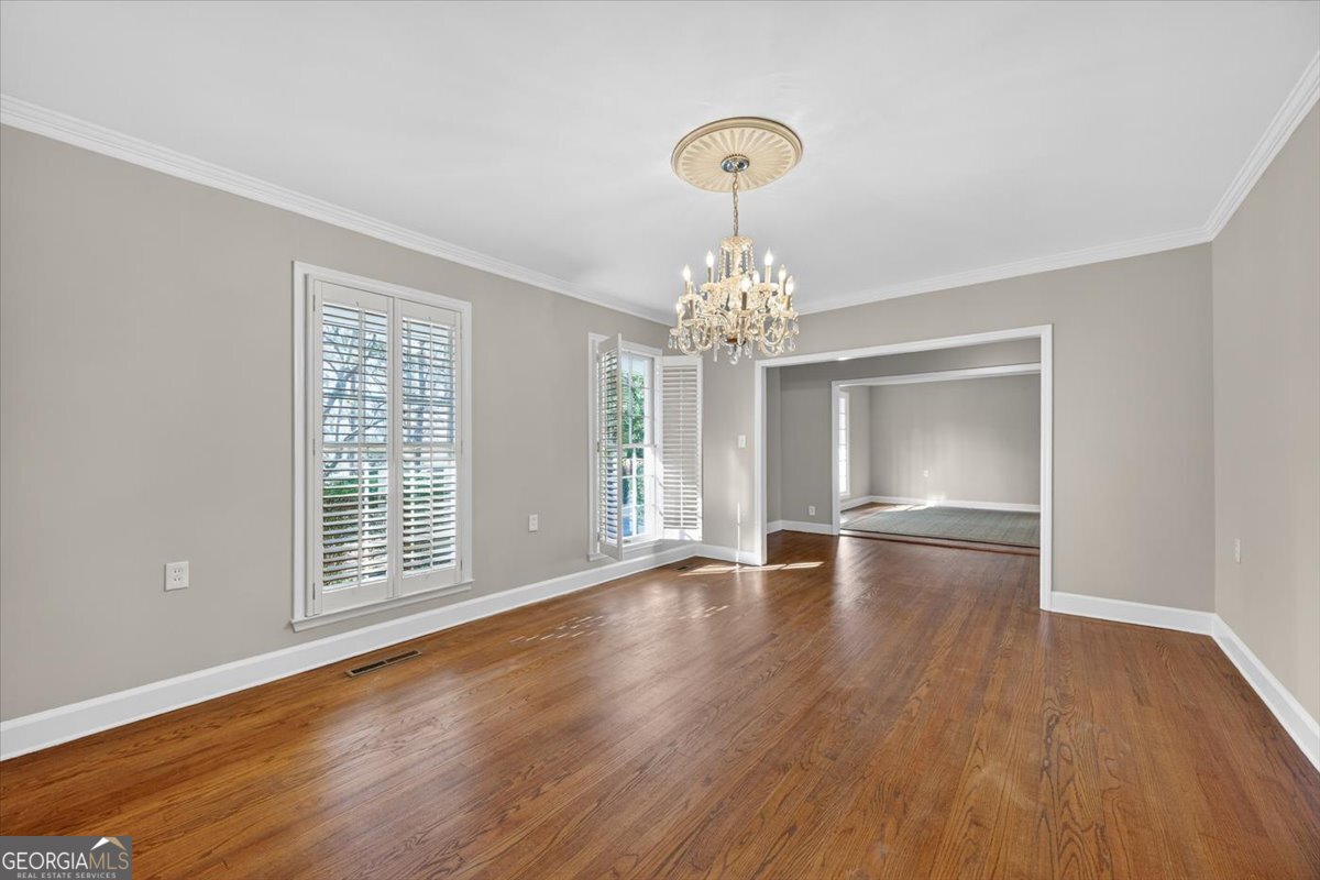 4555 Old Club Road Macon, GA 31210 - Photo 14 of 38 a view of an empty room with wooden floor and a window