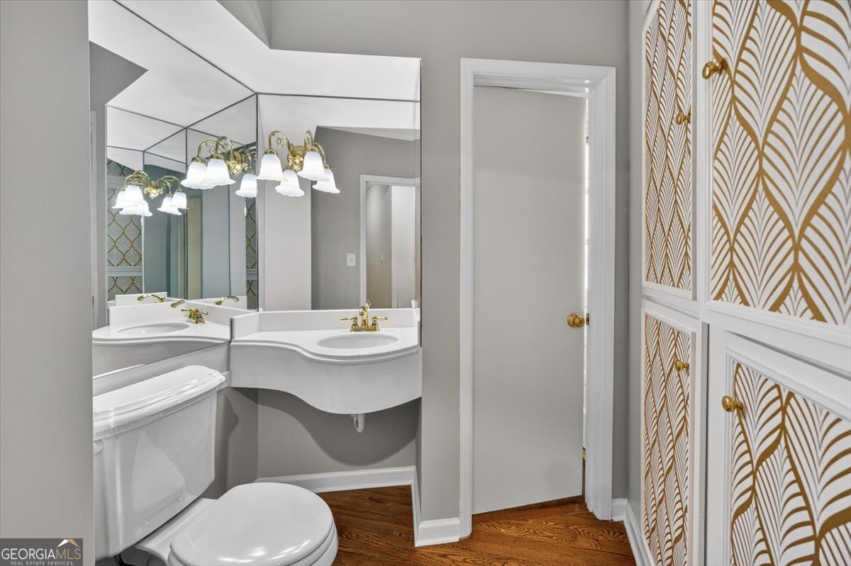 4555 Old Club Road Macon, GA 31210 - Photo 20 of 38 a bathroom with a sink a toilet and a mirror