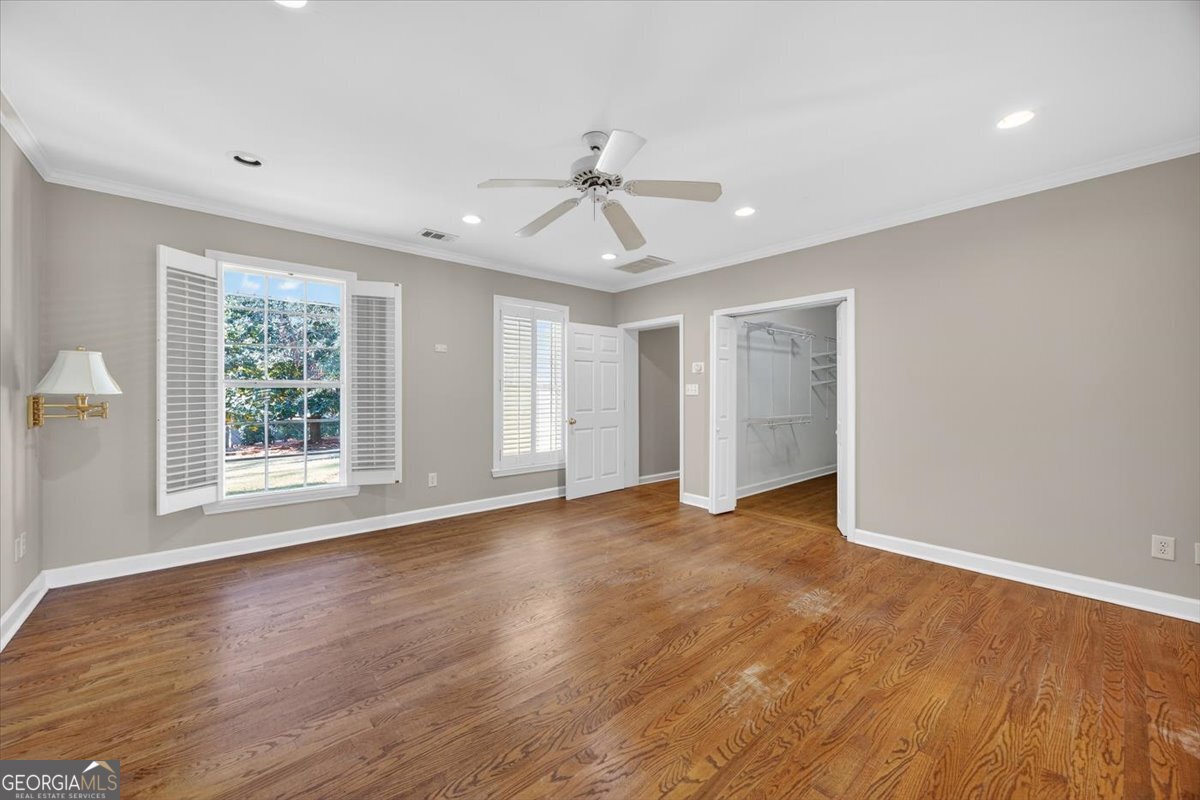 4555 Old Club Road Macon, GA 31210 - Photo 22 of 38 a view of an empty room with wooden floor and a window