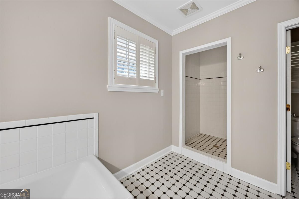 4555 Old Club Road Macon, GA 31210 - Photo 24 of 38 a bedroom with a bed and a window