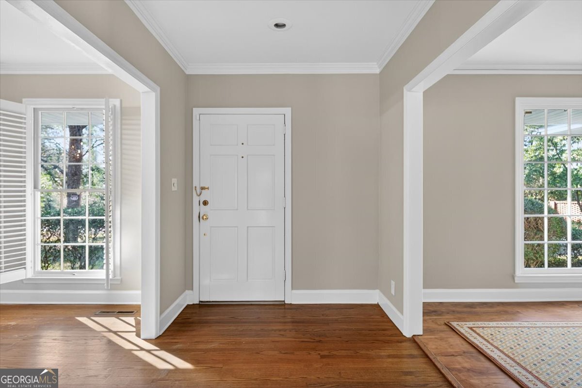 4555 Old Club Road Macon, GA 31210 - Photo 3 of 38 an empty room with wooden floor and windows