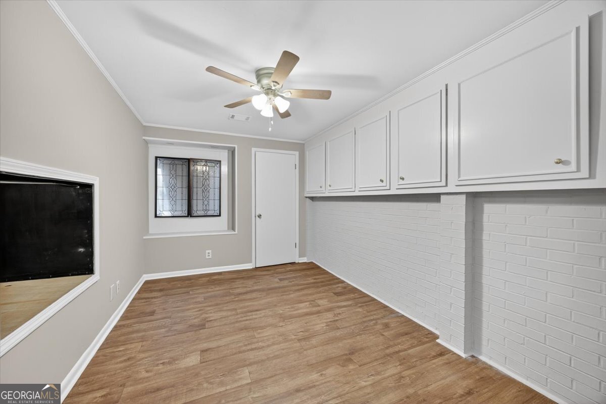 4555 Old Club Road Macon, GA 31210 - Photo 6 of 38 a view of empty room with wooden floor and fan