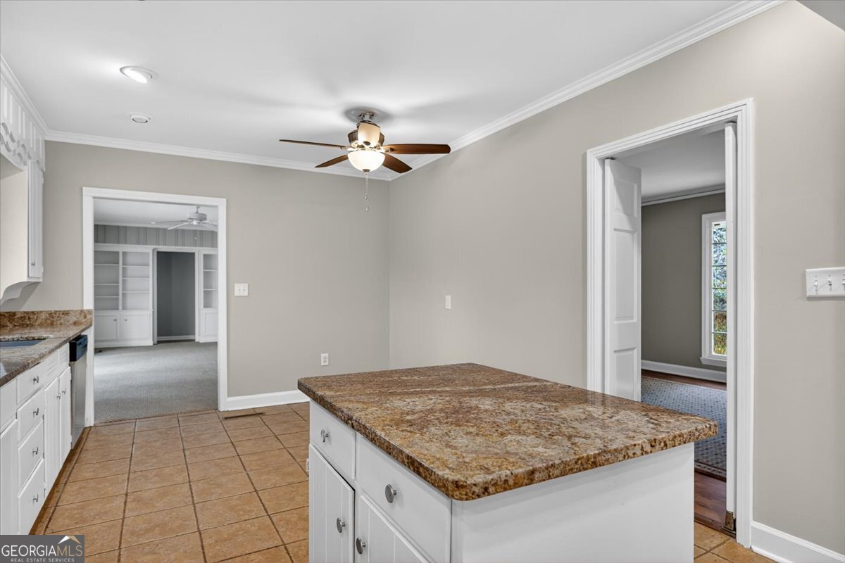 4555 Old Club Road Macon, GA 31210 - Photo 10 of 38 a view of kitchen island with granite countertop living room