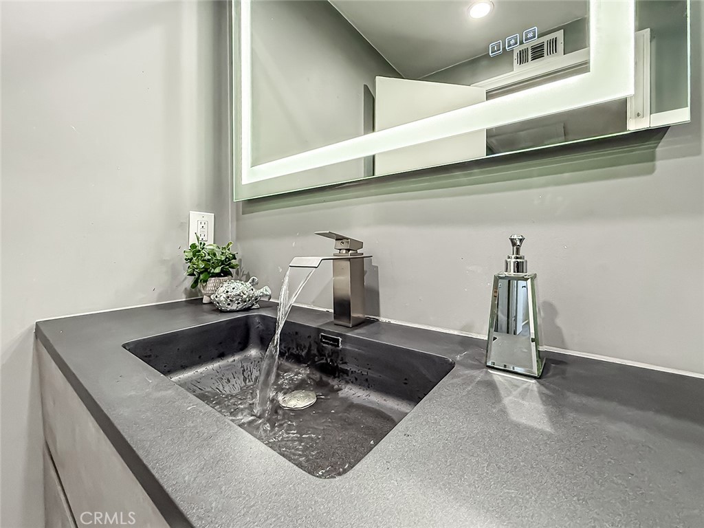 2235 Burnside Street Simi Valley, CA 93065 - Photo 40 of 71 a kitchen with a sink and chandelier